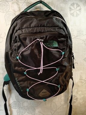 The North Face Black Backpack with Purple Cord and Teal Accents